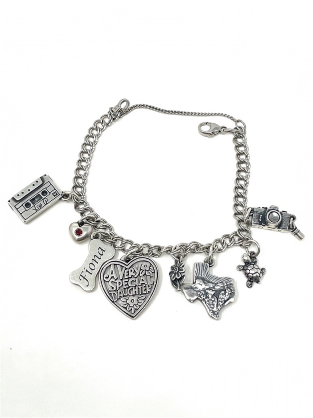 JAMES AVERY sterling silver charm bracelet, 8 charms